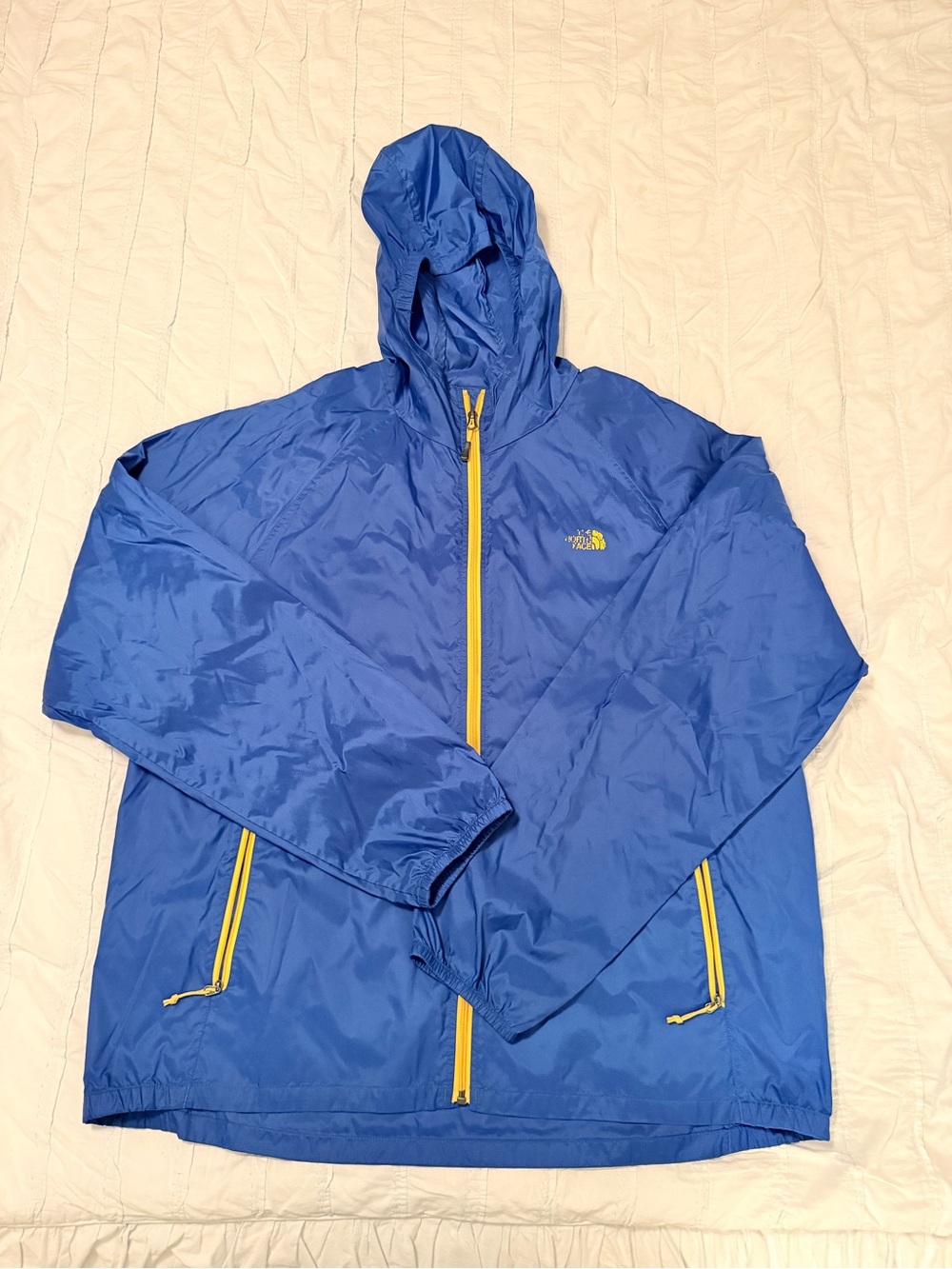 The North Face Blue Hooded Lightweight Jacket with Yellow Accents